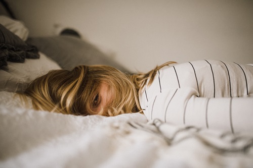 young woman trying to sleep