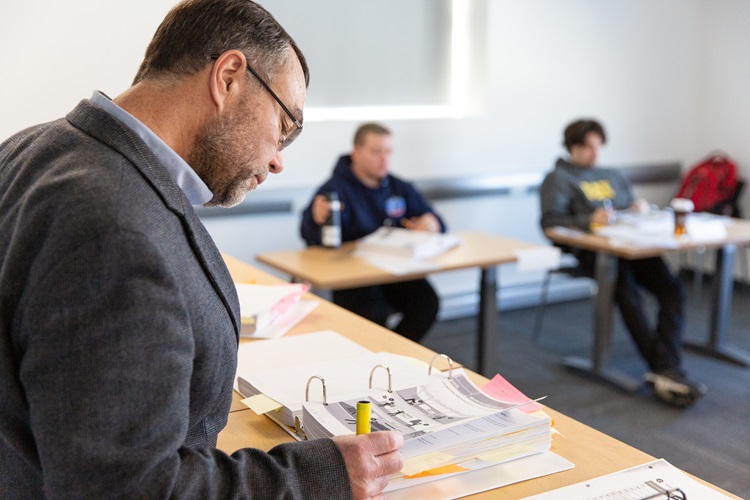 Man reading his notes