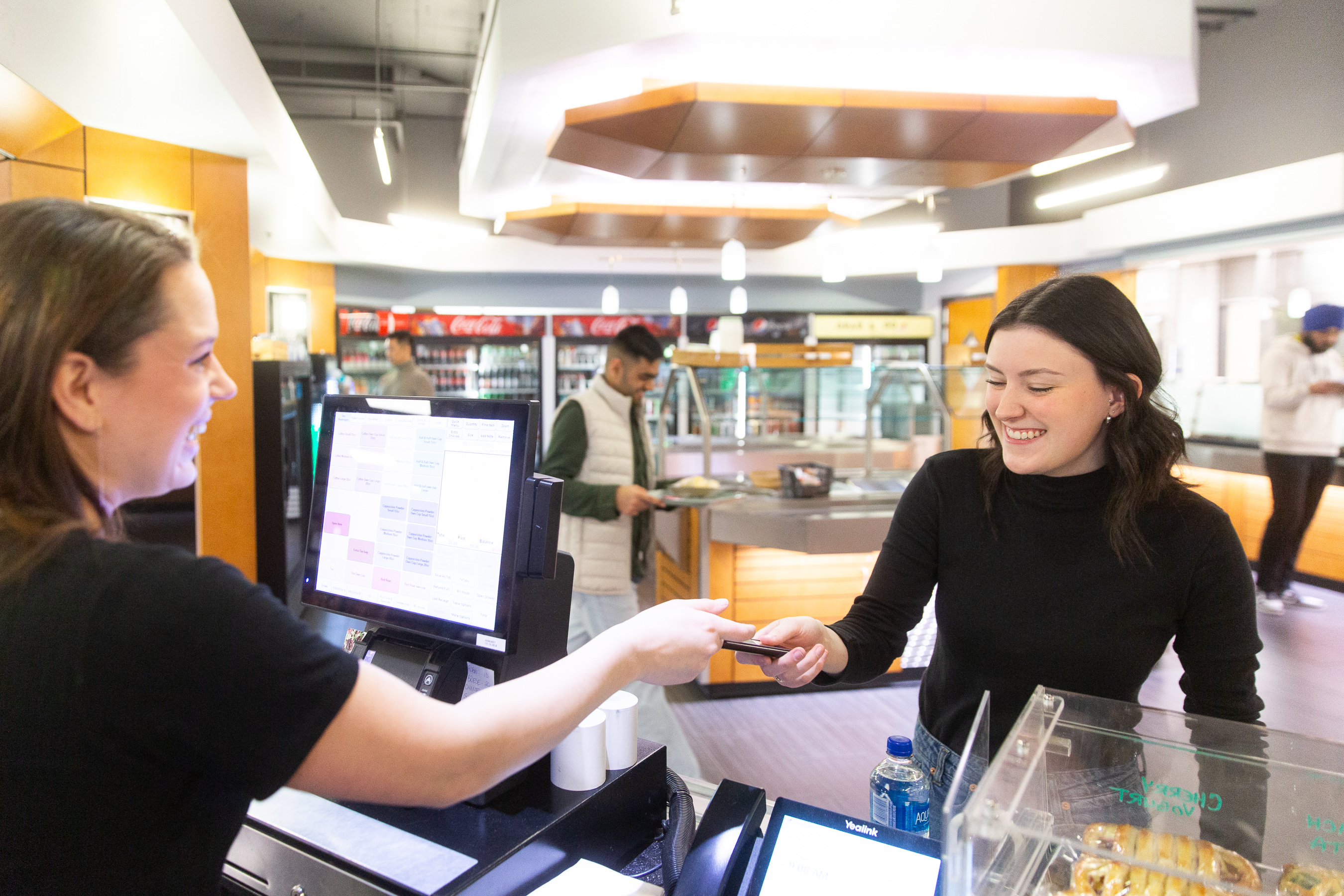 Student paying for food at cafeteria
