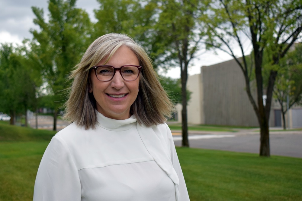 Cindy Heitman, CNC president and CEO standing in front of the CNC Prince George Campus